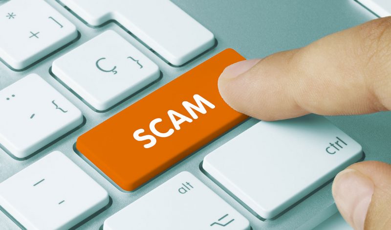 Image of scam button on keyboard